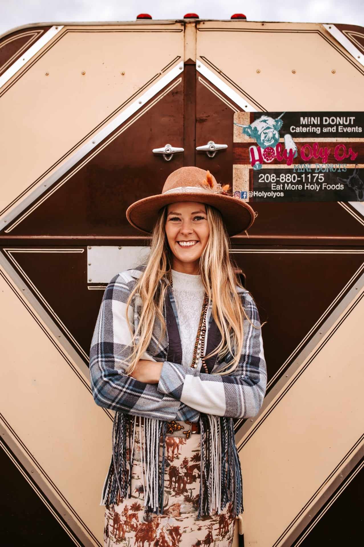 brown trailer with girl in front