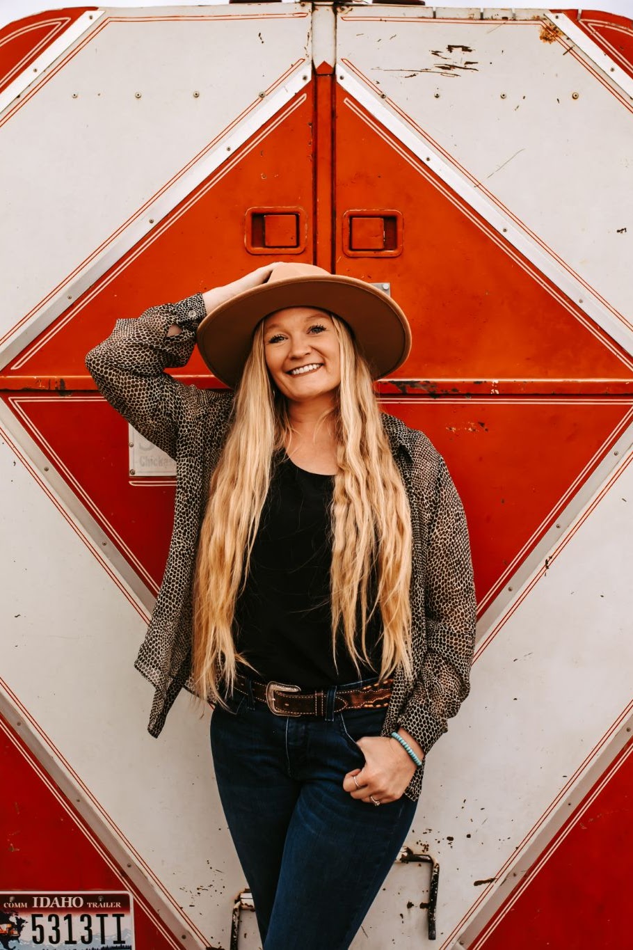 red trailer with girl in front